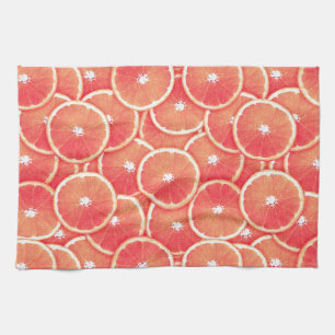 Pink grapefruit slices kitchen towel