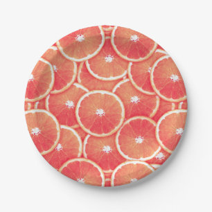 Pink grapefruit slices paper plate