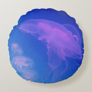 Pink jellyfishes in blue water round pillow