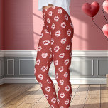 Pink Lipstick Kiss Print Red Leggings<br><div class="desc">Express your romantic side with these pink lipstick kiss print leggings on a bold red background. Perfect for Valentine's Day or anytime you want to add a fun and flirty element to your outfit. These comfortable leggings are designed with an eye-catching pattern of pink lip prints, adding a playful and...</div>