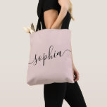 Pink Personalized Script Name Tote Bag<br><div class="desc">Chic pink and black personalized labelled tote bag with custom white name or any text for bridesmaid gifts, bachelorette parties, birthday favours, and girls trip keepsakes, and graduation gift for cute college and dorm room storage. Perfect for sports and hobby gear storage and transport. Colours and fonts are editable, just...</div>