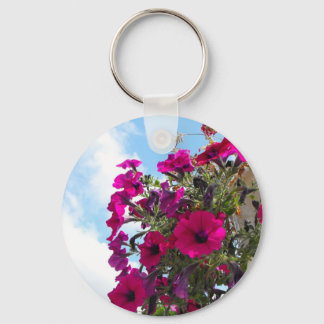 pink petunia flowers basket in blue sky keychain