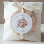 Pink Poinsettias Personalized Merry Christmas Classic Round Sticker<br><div class="desc">These floral holiday stickers feature a watercolor basket of pink and white poinsettias. The words "Merry Christmas" appear in beige serif font,  with your family's name below.</div>