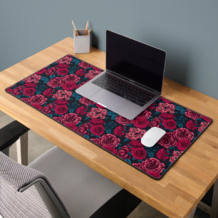 Pink, red and bi-colour roses with blue leaves on  desk mat