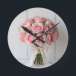Pink Rose Bouquet Pearl Lace Romantic Round Clock<br><div class="desc">Delicate and dreamy bouquet of soft pastel pink roses wrapped in ivory lace and pearl accents. This gentle,  feminine composition radiates timeless romance,  elegance and quiet sophistication the perfect expression of tender love,  bridal grace and classic feminine beauty.</div>
