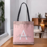Pink Rose Gold Blush Pink Glitter Elegant Monogram Tote Bag<br><div class="desc">Pink Rose Gold and Blush Pink Faux Sparkle and Dripping Glitter Elegant Monogram Book Bag. This Book Bag can be customized to include your initial and first name and given as a gift for Christmas,  Sweet 16 Birthday,  Bridal Shower or a Wedding.</div>