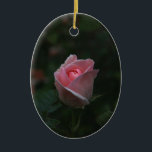 Pink rosebud ceramic ornament<br><div class="desc">Beautiful pink rosebud on dark green background. Photography.</div>