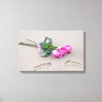 pink roses and footprints in sand