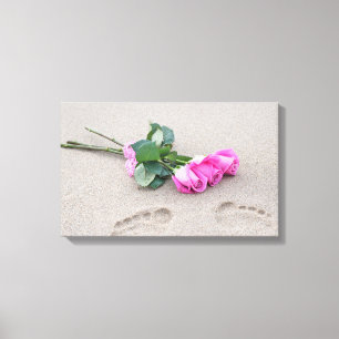 pink roses and footprints in sand canvas print