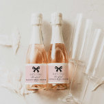 Pink She's Tying the Knot Sparkling Wine Label<br><div class="desc">Celebrate in style with these pink 'She’s Tying the Knot' mini champagne labels featuring a chic bow design. Perfect for bridal shower favours,  these elegant labels are customizable with the bride’s name and party details to add a personal touch. Check out our matching items</div>