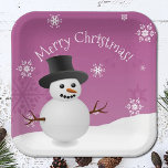 Pink Snowman Winter Scenery Christmas Paper Plate<br><div class="desc">Brighten your holiday party supplies with this Pink Snowman Winter Scenery Paper Plates, perfect for your Christmas party supply needs. These charming plates feature a winter scene with a snowman and top hat, accented by white snowflakes and falling snow. The holiday typography displaying "Merry Christmas" adds a joyful touch to...</div>