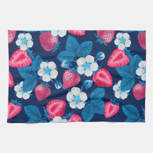 Pink strawberries on blue kitchen towel