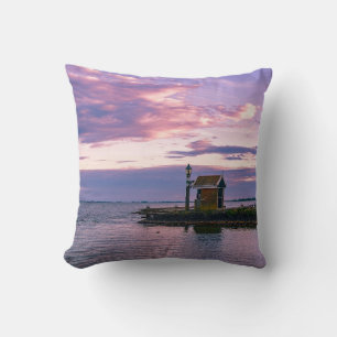 Pink sunset over lake throw pillow