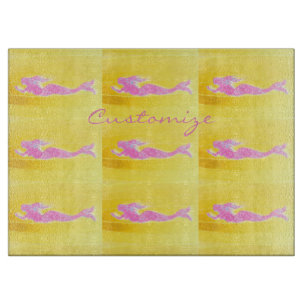 pink swimming mermaids cutting board