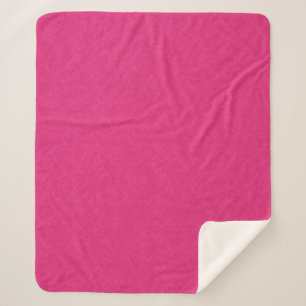 Pink textured surface with subtle swirling pattern sherpa blanket