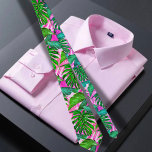 Pink Tropical Hawaiian pattern Tie<br><div class="desc">The Hawaiian print men's neck tie features a captivating illustration of green and pink tropical leaves, exuding a vibrant and eye-catching design. The tie showcases a harmonious blend of lush green leaves and vibrant pink accents, creating a visually striking combination. The green leaves symbolize the abundant foliage found in the...</div>