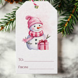 Pink Watercolor Snowman To and From Christmas Gift Tags<br><div class="desc">This adorable Christmas gift tag showcases a sweet pink watercolor snowman in a cozy hat and scarf, with a beautifully wrapped present. Add a personal touch by writing your names in the "to" and "from" areas for the giver and recipient. Whether you attach them to gifts, gift bags, wine bottles,...</div>