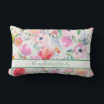 Pink watercolored florals family name script lumbar pillow<br><div class="desc">Romantic, bohemian, boho style. Soft, feminine watercolored flowers in pink, green and peach colours with green foliage on a white background. Personalize and add your name or family name written with a green coloured modern hand lettered script with swashes. To keep the swashes only delete the sample name, leave the...</div>