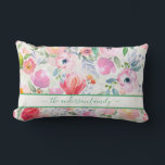 Pink watercolored florals family name script lumbar pillow<br><div class="desc">Romantic, bohemian, boho style. Soft, feminine watercolored flowers in pink, green and peach colours with green foliage on a white background. Personalize and add your name or family name written with a green coloured modern hand lettered script with swashes. To keep the swashes only delete the sample name, leave the...</div>