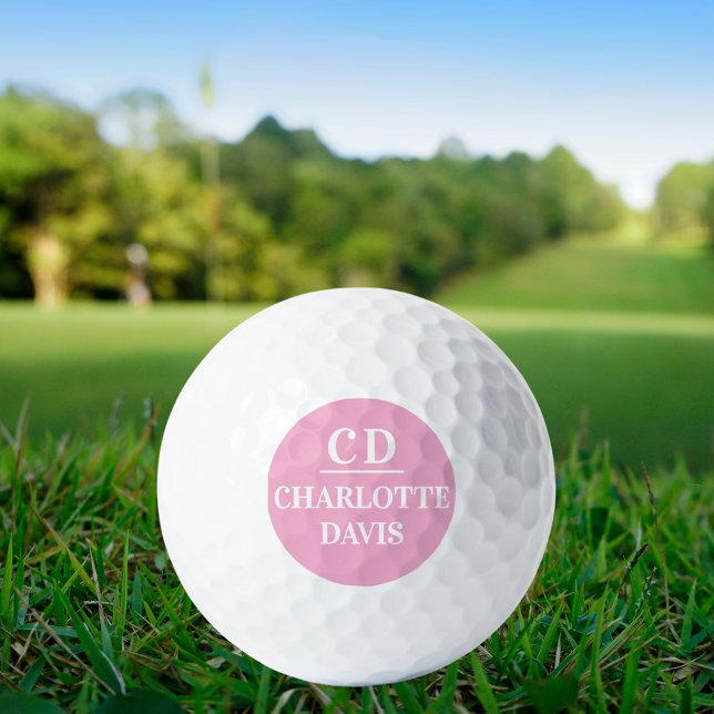 Pink white monogram initials name golf balls (Creator Uploaded)