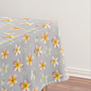 Pink & White Plumeria Flowers on Light Grey Tablecloth