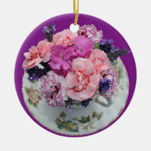 Pinks carnations in teacup ceramic ornament