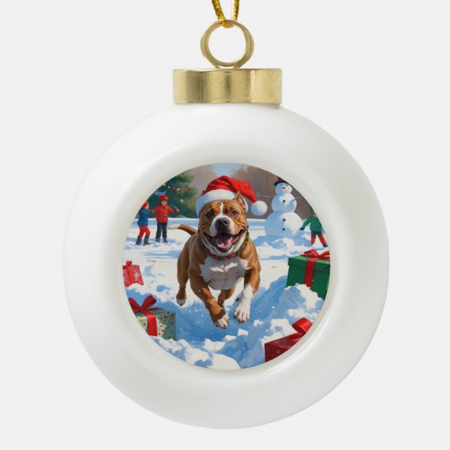 Pitbull Dog Running in Snow with Christmas Hat Ceramic Ball Christmas Ornament (Front)