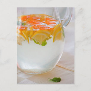 Pitcher with water and fruits postcard