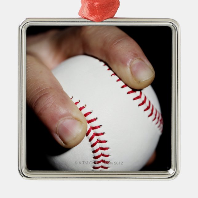 Pitchers hand gripping a baseball metal ornament (Front)