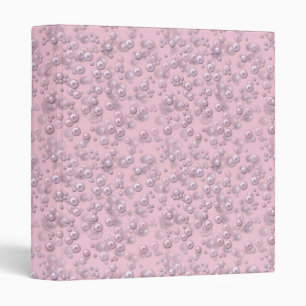 Placers of white-pink pearls on pink velvet binder