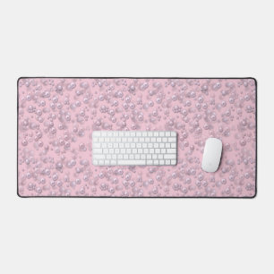 Placers of white-pink pearls on pink velvet desk mat