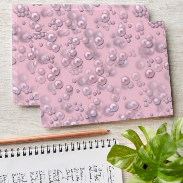 Placers of white-pink pearls on pink velvet envelope (Stacked)