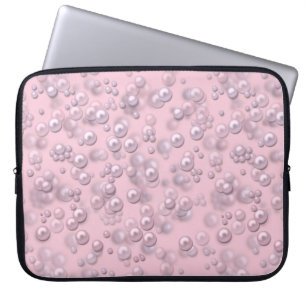 Placers of white-pink pearls on pink velvet laptop sleeve