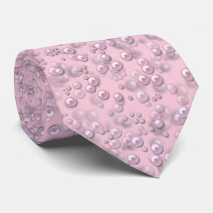Placers of white-pink pearls on pink velvet tie