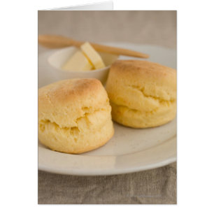 Plain scone with butter on plate