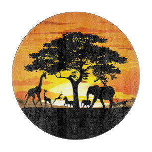 Planche À Découper Animaux sauvages sur le coucher de soleil de la sa