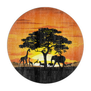 Planche À Découper Animaux sauvages sur le coucher de soleil de la sa