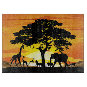 Planche À Découper Animaux sauvages sur le coucher de soleil de la sa