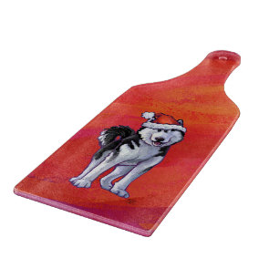 Planche À Découper Chien de traîneau dans le casquette de Père Noë