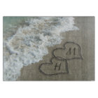 Coeurs bloqués sur le sable de plage