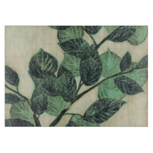 Planche À Découper Feuille et branches sur l'arrière - plan crème