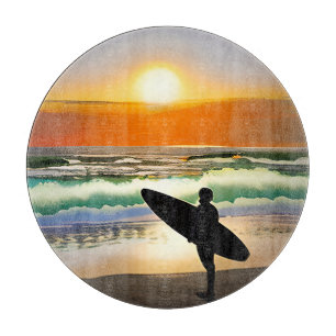 Planche À Découper Guy sur la plage avec coucher de soleil sur le Sur