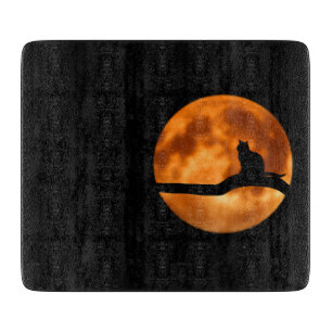 Planche À Découper Silhouette d'un chat noir dans un arbre