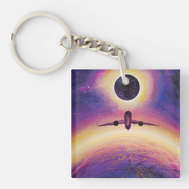 Plane in flight city and eclipse keychain (Front)