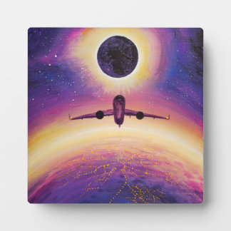 Plane in flight city and eclipse plaque