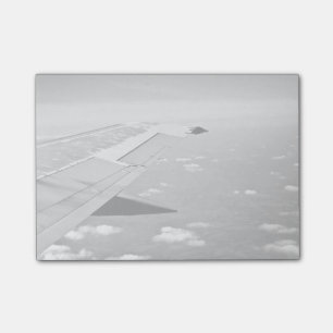 Plane Themed, Grayscale Airplane Wings Flying Over Post-it Notes