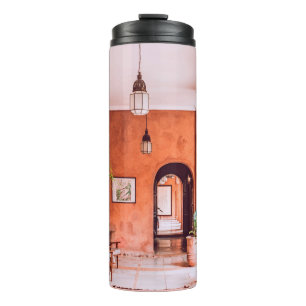 PLANTERS WITH PLANT NEAR AREA RUG INSIDE ROOM THERMAL TUMBLER