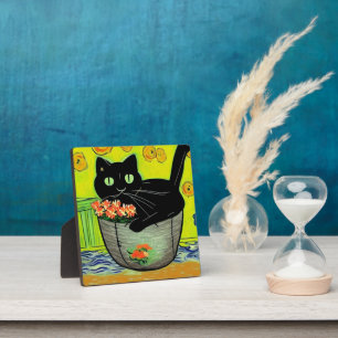 Plaque Photo Chat noir dans un pot de fleurs