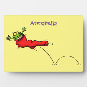 Plaque Photo Cute grenouille dans une chaussette rouge saut de
