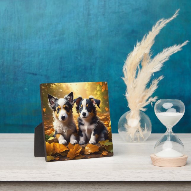 Plaque Photo Deux mignons chiots qui jouent dans les feuilles d (Insitu)